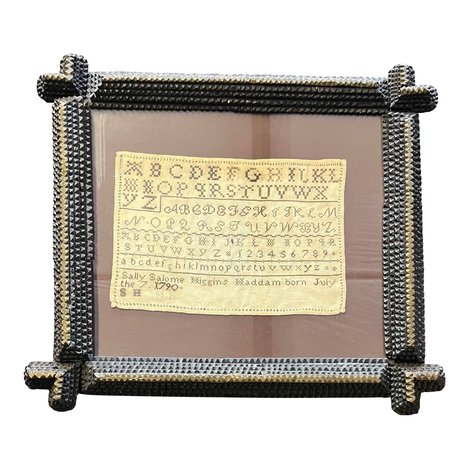 Antique Needlepoint Sampler With Tramp Art Frame: Antique needlepoint sampler in tramp art frame. Handkerchief size with multiple stitched fonts of the alphabet and numbers. Signed Sally Salome Higgins Haddam, born July 7, 1790. Dates to around