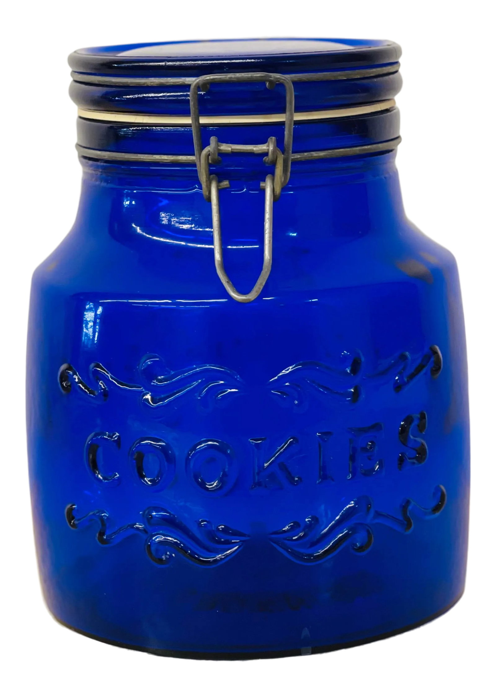 1970s Vintage Italian Cobalt Blue Glass Cookie Jar: Stunning Vintage 1979 Italian Cobalt Blue Glass Cookie Jar with Wire Latch Lid. 2 Quarts. Measures 7.25" tall x 5.75" in diameter. Lovely piece in excellent vintage condition. Maker's mark on bottom.