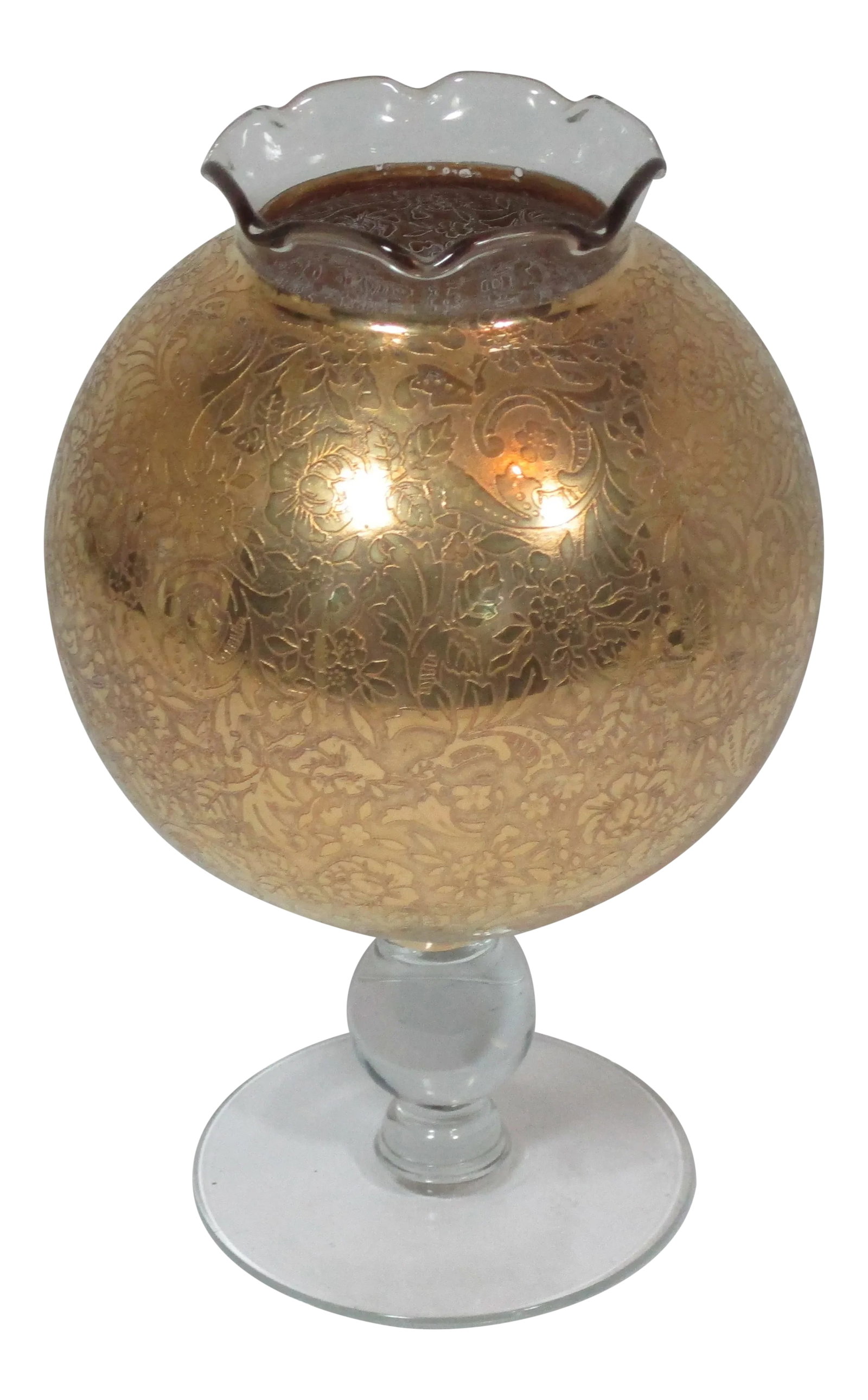 1950s Hollywood Regency Stemmed Rose Vase: Hollywood Regency round glass vase with gold overlay, a clear stem and ruffled rim. The gold overlay has a allover intricate floral and scroll design. This unique vase will accent your room sitting on