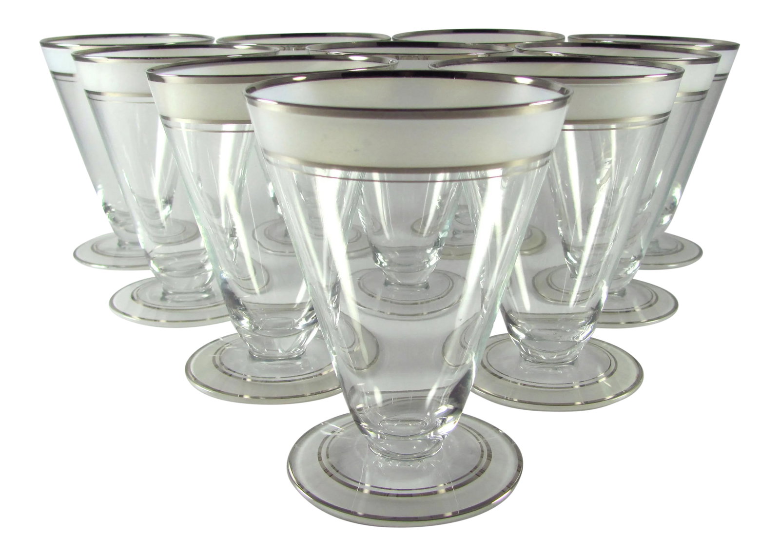 1930s Art Deco Platinum and Frosted Band Footed Conical Glass Tumblers - Set of 10: Manufactured in the 1930s by West Virginia Specialty Glass Company, this is their line No. 7697 No chips nor cracks nor cloudiness Overall the platinum and frosted white graphics are vibrant and