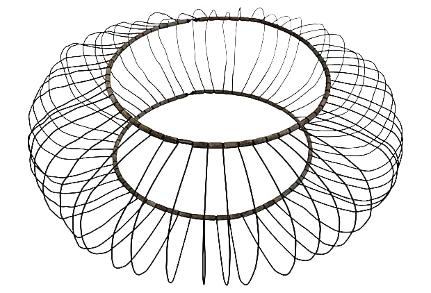 Antique Tire Frame Sculpture: Circa the 1900s, this unusual sculpture was composed of metal wire laid inside of a tire frame. Wood pieces interlock each piece of wire. Condition: Alterations: Original Condition Unaltered