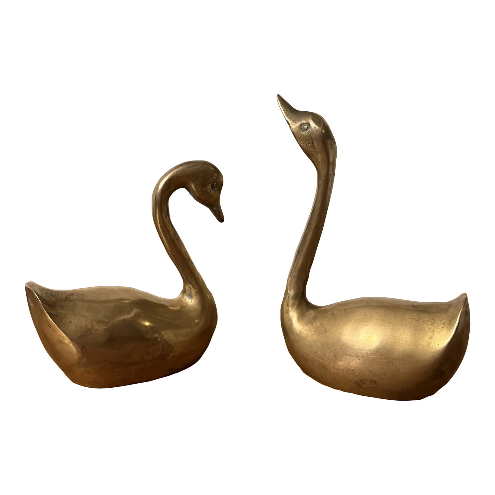 Mid Century Vintage Brass Swan- a Pair: This is a pair of mid-century brass swan figurines. MEASUREMENTS Swan 15.25 in x 3.5 in x 1.75 in Swan 24 in x 3.25 in x 1.75 in Condition: Alterations: Original Condition Unaltered Imperfections:
