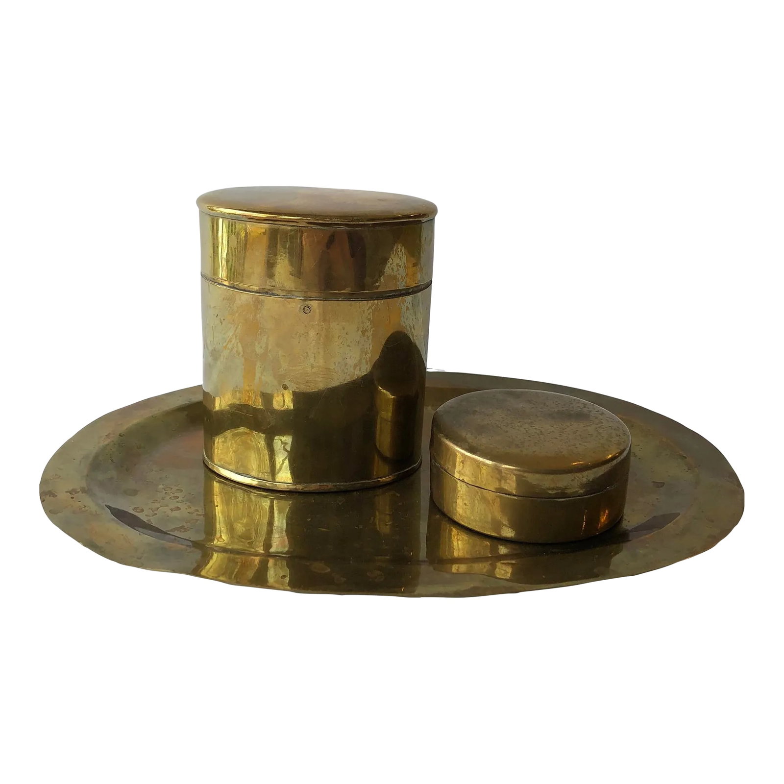 Vintage Brass Vanity Set, 3 Pieces: Vintage brass vanity set consisting of an oval tray and two lidded (hinged) containers. Tall oval container: 3.5" x 2.6" x 4" Shirt circle container: 3" x 3" x 1.25" Tray: 10.4" x 7.25" x 0.5"