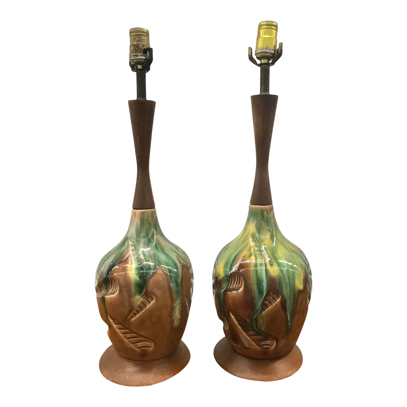 1960s Mid-Century Modern Lamps - a Pair: Mid-Century Modern oval ceramic pair of lamps in glossy caramel brown with green and yellow drifting from top with the Neck and Base in Walnut, this pair my need to be Rewire. The electrical cord