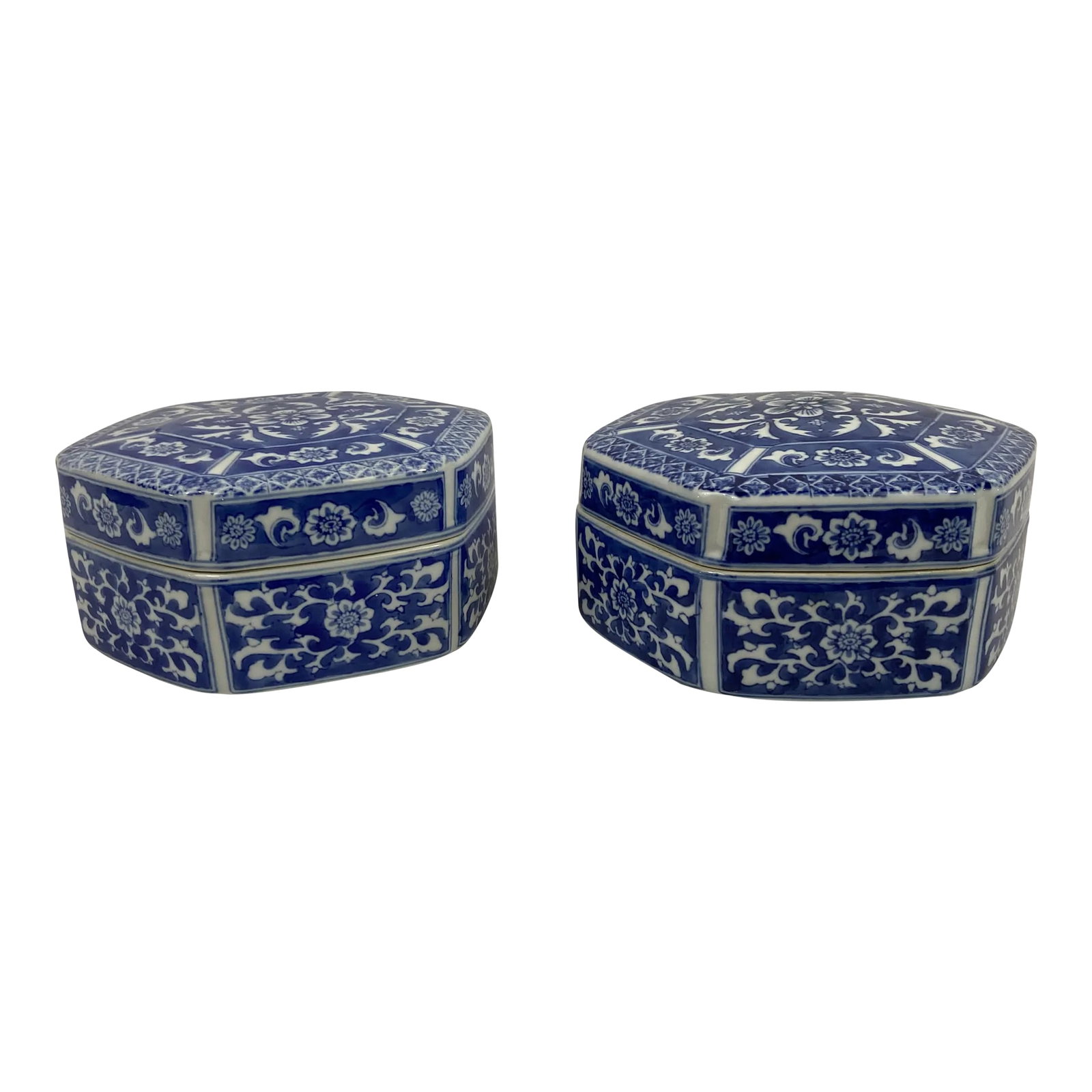 Vintage Blue and White Chinese Porcelain Boxes- a Pair: Pair of unique Chinese export porcelain hexagonal shaped boxes with lids featuring traditional blue and white enamel decoration in floral patterns. Condition: Alterations: Original Condition