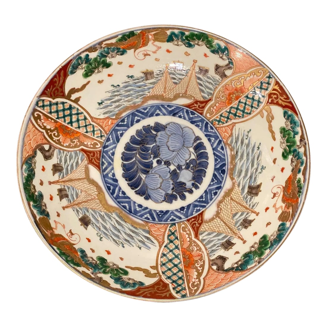 Japanese Meiji Period Imari Porcelain Harger / Plate: A fine 19th C. Meiji period Japanese porcelain plate or charger. The plate is decorated in the traditional colors of blue, persimmon, green and white. There is also leaf decoration on the underside. C