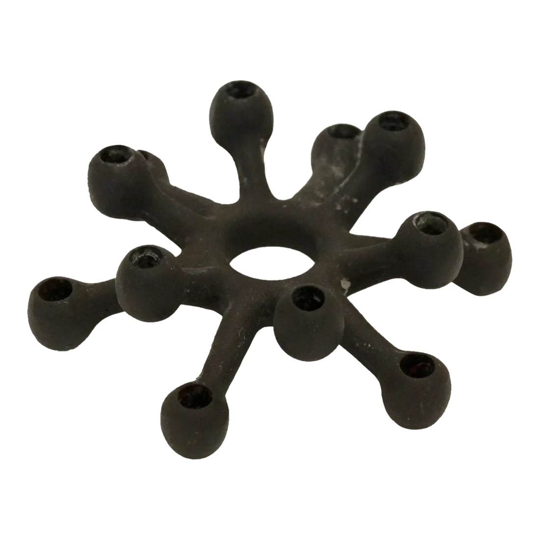 1960s Midcentury Modern Jens Quistgaard for Dansk Tiny Taper Holder Cast Iron Spider Candleholder: Handsome and iconic cast iron "tiny taper holder" was Jens Quistgaard's first and most popular candelabra design for Dansk, produced in 1962. Known as the "spider" candleholders by collector's and mid