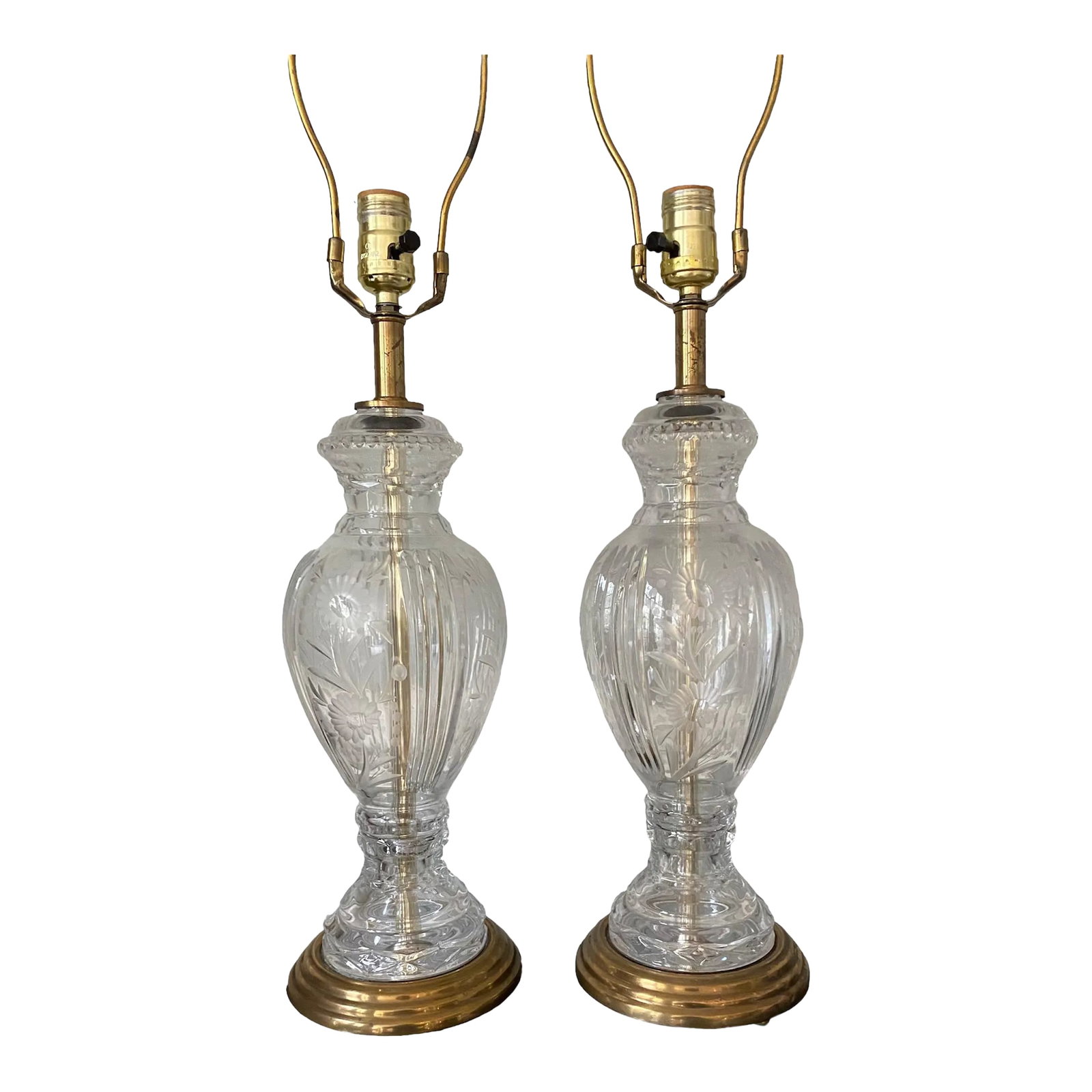 Vintage Cut and Etched Crystal Table Lamps, a Pair: This is a pair of outstanding etched crystal glass table lamps with all brass hardware. They are both in working order. The lamps are in a soft urn shape decorated with four vertical columns of deep r