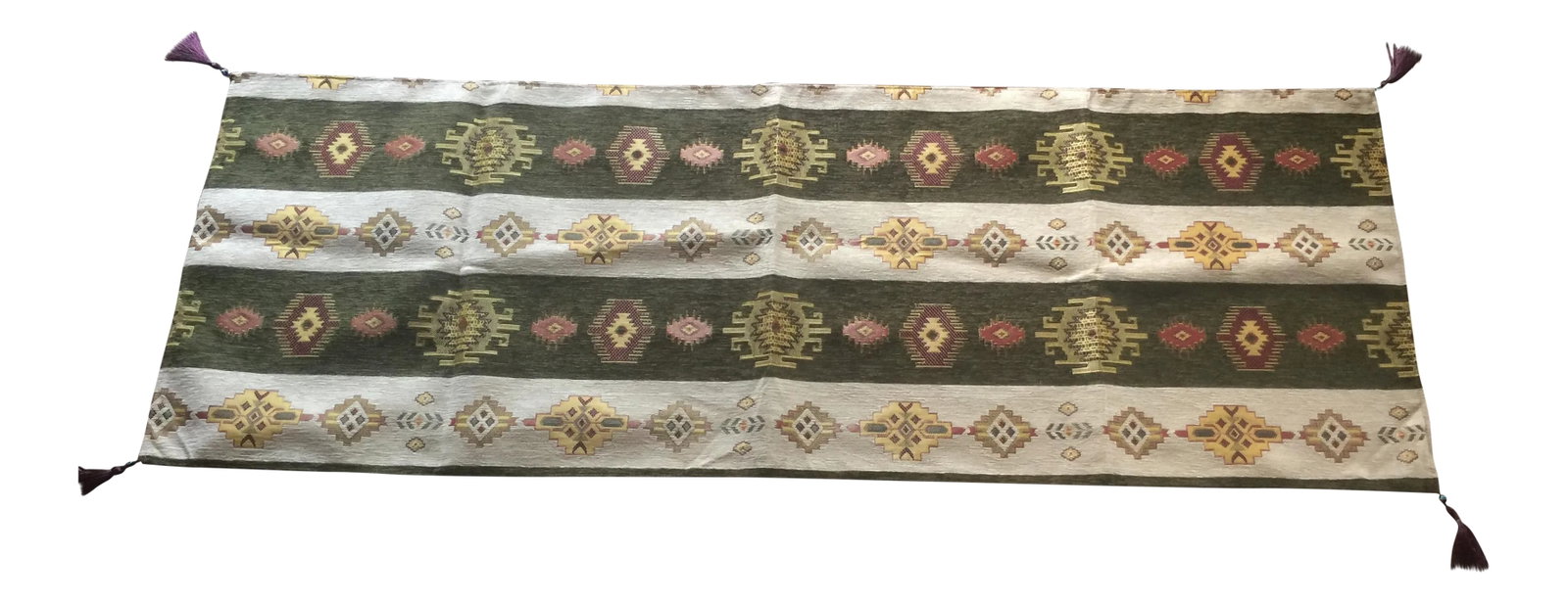 Authentic Turkish Kilim Motif 54"x 18.5"Table Runner: 54"x 18.5" Kilim motif table runner in green Fabric made from velvet and cotton Weaved by Turkic motifs Both end have decorative tassels Made in Turkey Condition: Imperfections: No Imperfections