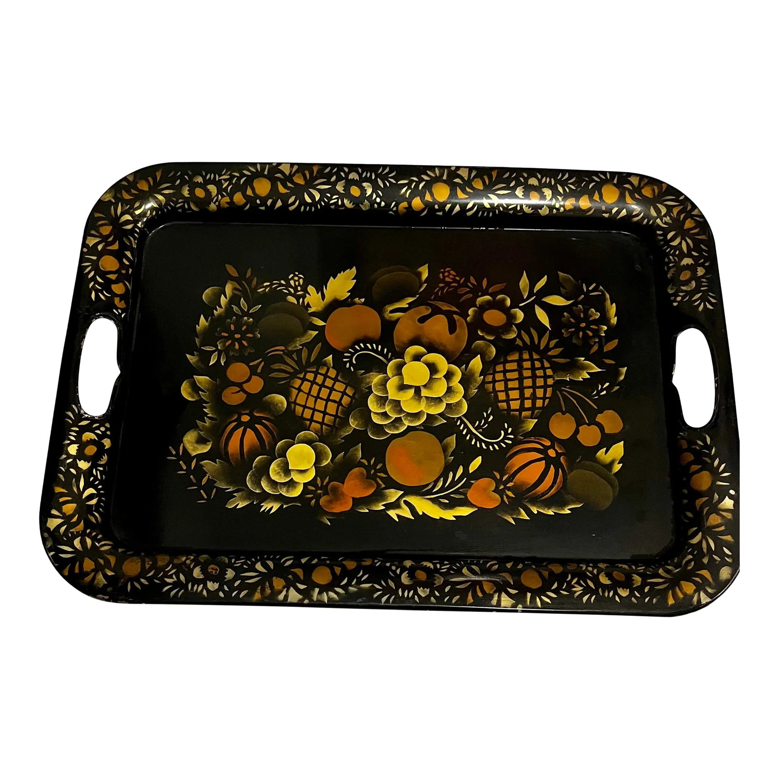 Black and Gold Toleware Tray With Hand Painted Fruits and Flowers: Go for the gold (and copper)! This vintage toleware serving tray features regal hand painted flowers and pineapple artwork in gold and copper on a black background. Inset handles make lifting and