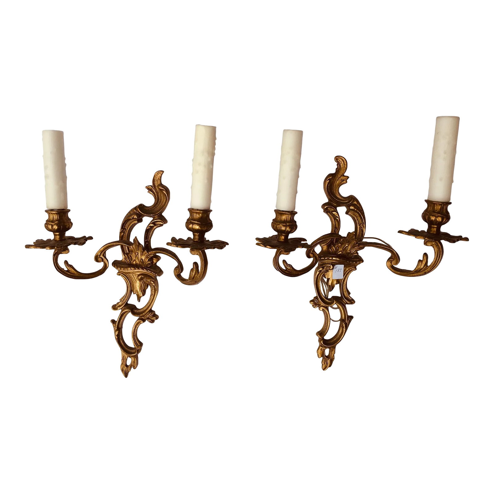 Pair of French Bronze Sconces: This pair of sconces has been professionally rewired Purchased in the south of France Dating from The 40's Height includes candles 15.75 Height of backplate 13 Width of back plate 3 Projection 3.75 A