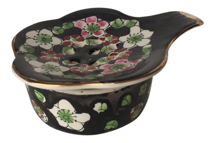 Vintage Floral Porcelain Tea Strainer & Holder - 2 Piece: Vintage Elegant Floral Design Porcelain Tea Stainer and Holder , No Makers Mark. Dimensions :Stainer is 3.75"L X 3.25"W Holder is 2.5"D X 1"H Both in Excellent condition Condition: Alterations: