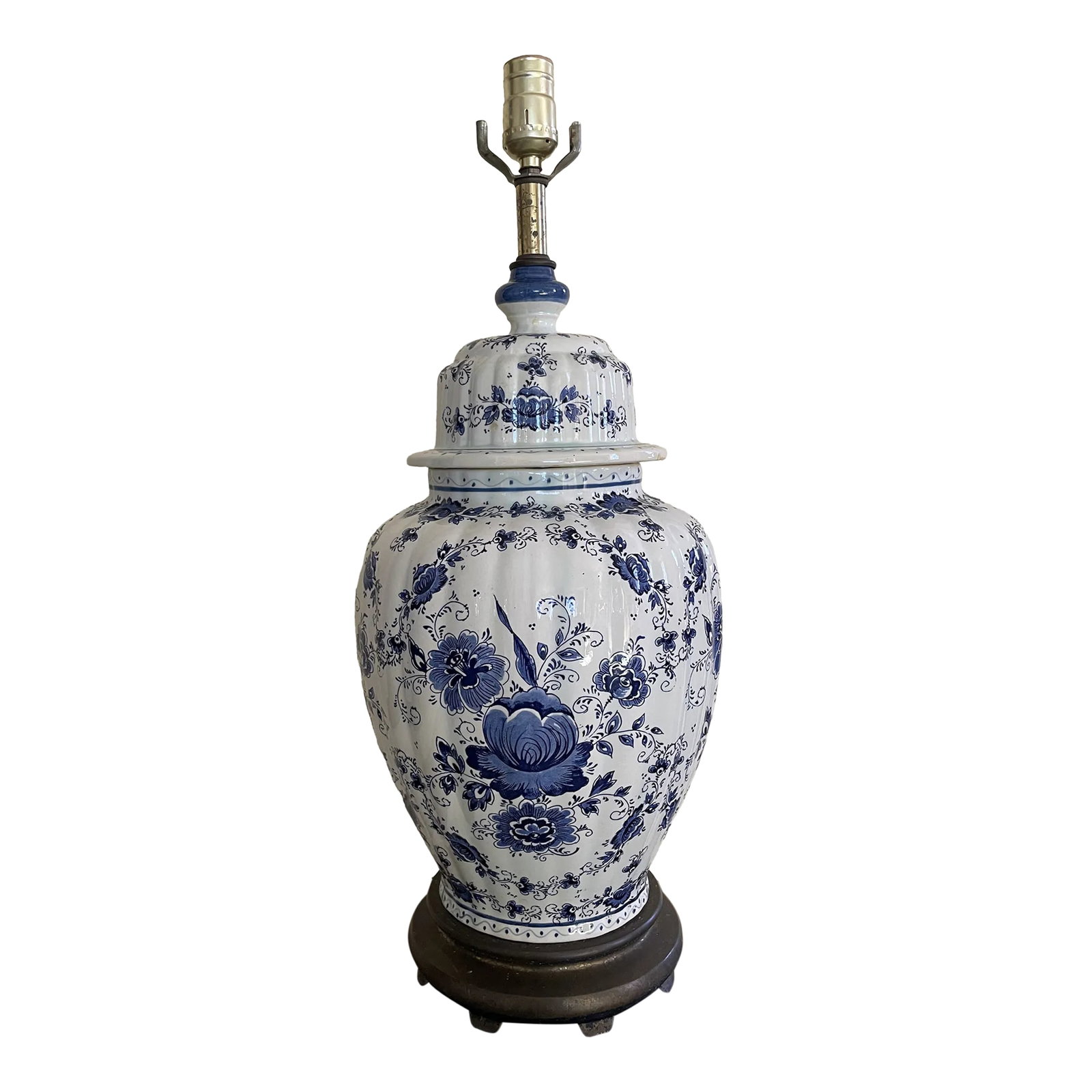 Large Delft Ginger Jar Lamp: This beautiful lamp is a ginger jar of blue and white Delft floral patterns. The base is a painted metal. Perfect between twin beds or the corner of a room. Condition: Alterations: Original Condition