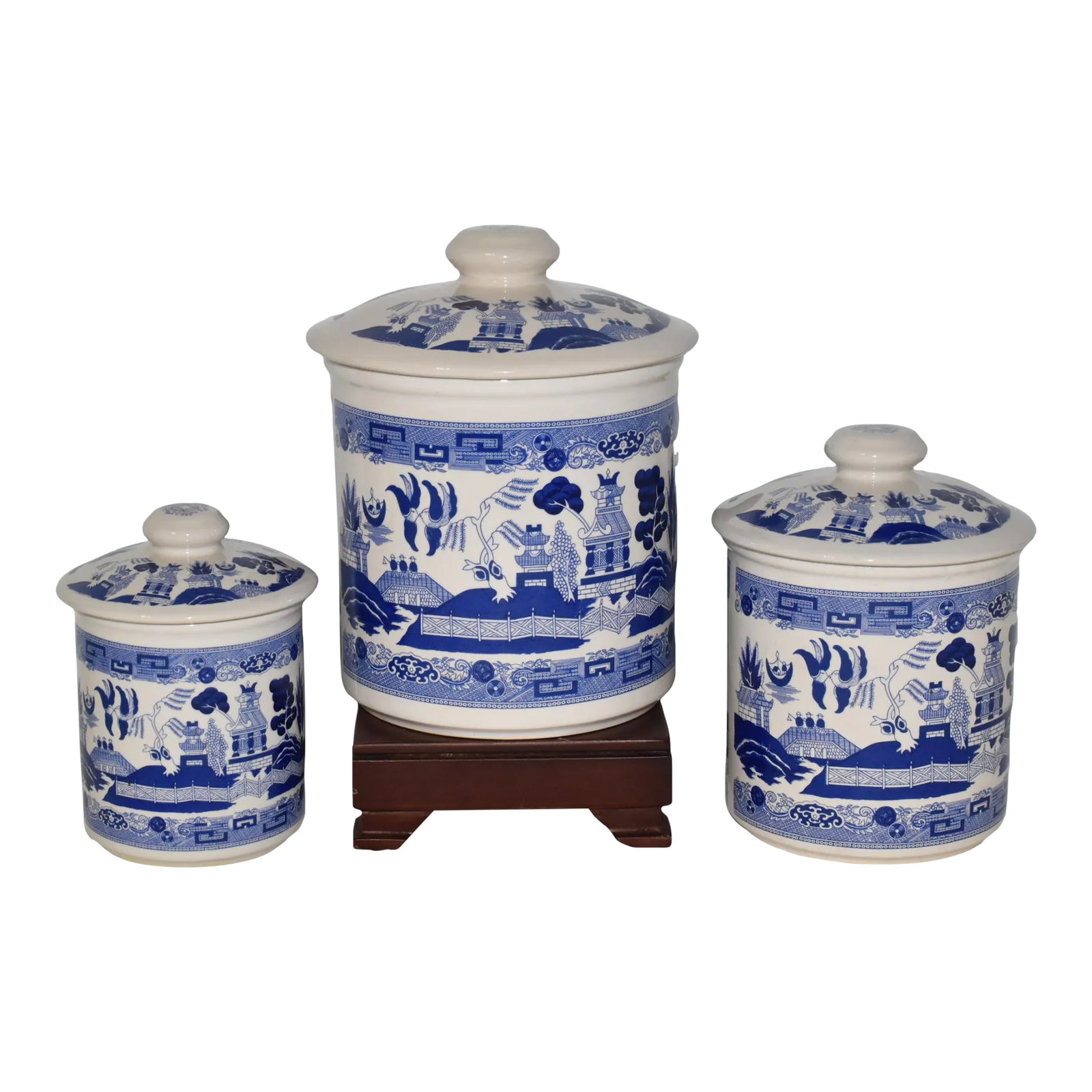 Early 20th Century Transferware Blue Willow 3 Piece Canister Set Blue White Ceramic Canisters: A Nice Rare Find! 3pc Set of Early 20th Century Transferware Blue Willow Canisters. Depicting the iconic blue willow landscaped scene of birds, boat, water, willow tree, cherry tree, pagoda, fence