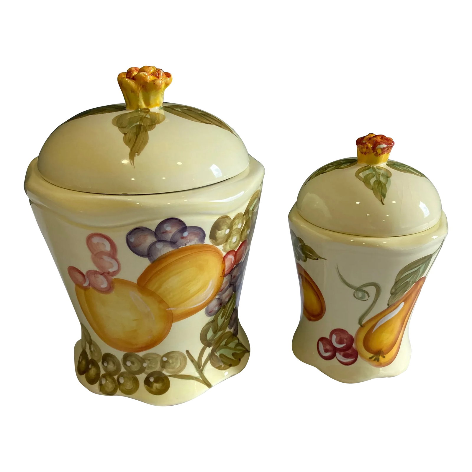 1960s Vintage French Country Fruit Canisters, Set of 2: A set of 2 pretty ceramic fruit canisters by WCL of China. In vintage condition with some small chips. Large: 8.25" T x 6.25" Round Small: 6.75" T x 4.5" Round Condition: Alterations: Original