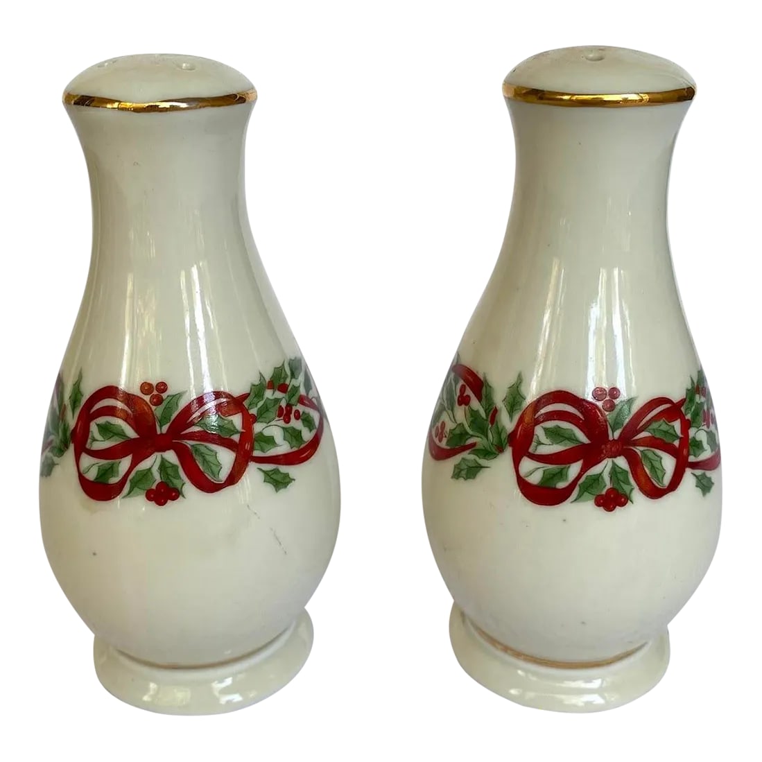 Vintage Centurion Ribbon Holly Salt & Pepper Set - Holly & Red Ribbon Rim, Gold Trim- Set of 2: CENTURION Ceramics, a well-known American ceramics company, was founded in the early 1940s in the United States. The company was recognized for its quality craftsmanship and attention to detail. The