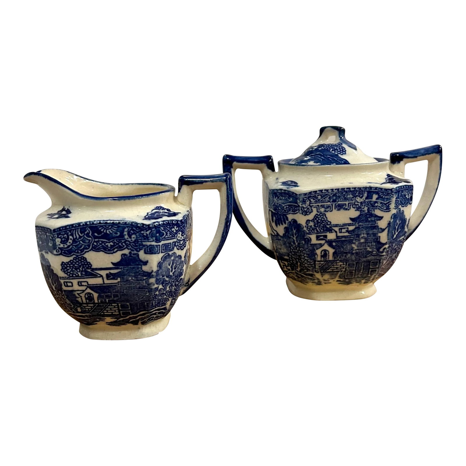 Art Deco Blue Willow Transferware Sugar and Creamer Set, 2 Pieces: This vintage Art Deco inspired lidded sugar bowl and creamer set featuring the traditional blue and white Willow pattern have an interesting squared off design, thanks to Japanese design ingenuity.