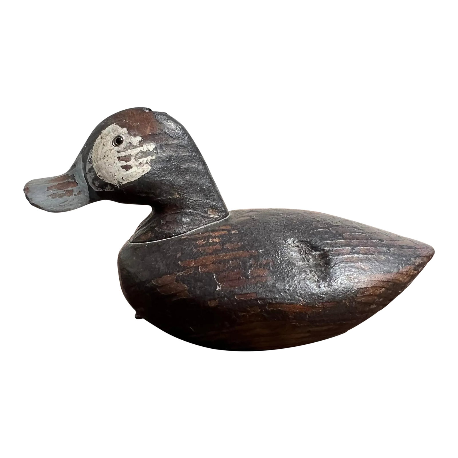 Mid-Century Hand Carved and Painted Wooden Duck Decoy: A charming American mid-century hand carved and painted wooden duck decoy. Exceptionally executed, hand crafted block of wood carved to resemble a duck decoy. Having original, nicely aged patina, uniq