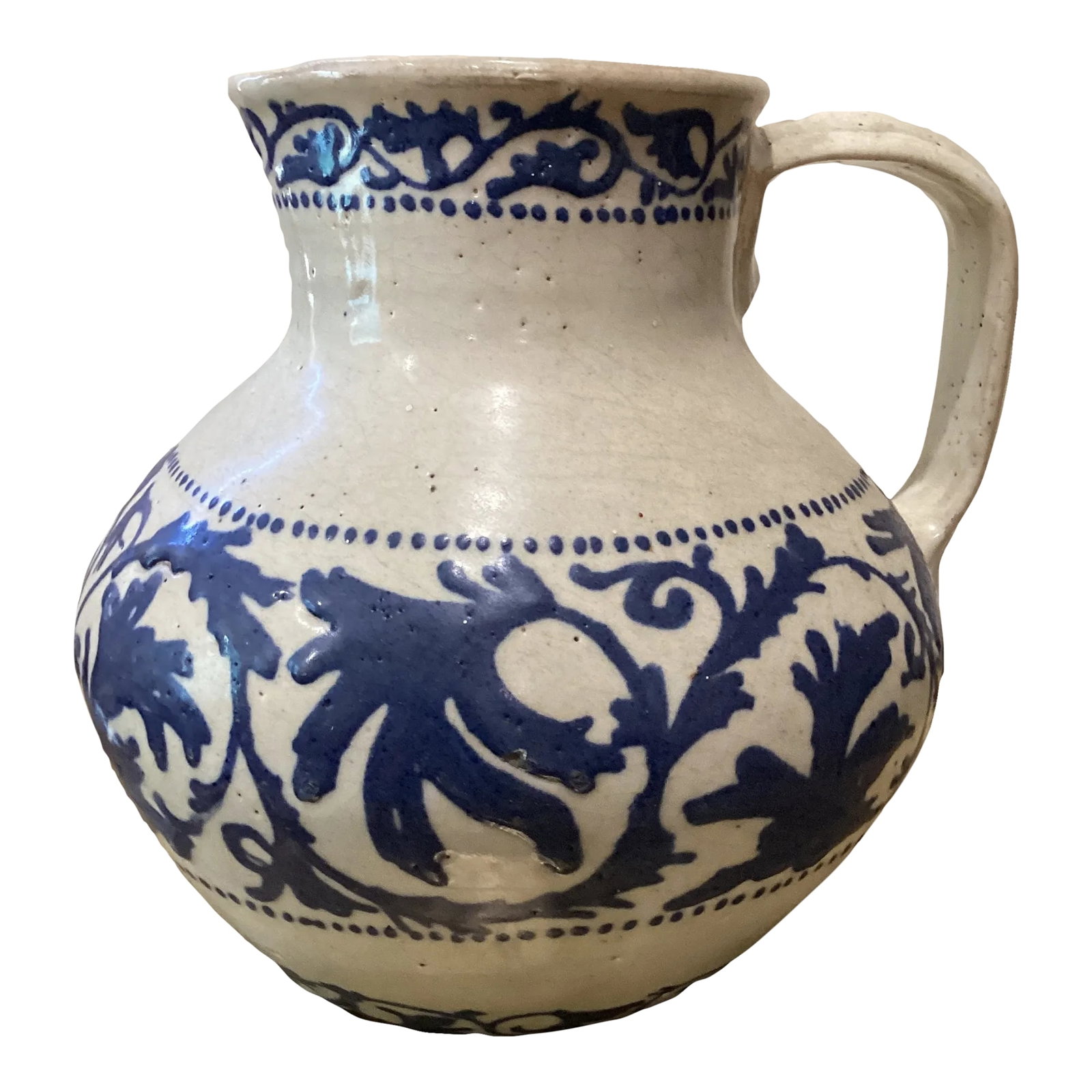 19th Century Handmade & Hand-Painted Glazed Terracotta Pitcher: Attractive mid-19th century example of a blue on white pottery pitcher created in Spain. A floral pattern in deep cobalt over a cream hued glaze. Condition: Alterations: Original Condition Unaltered I