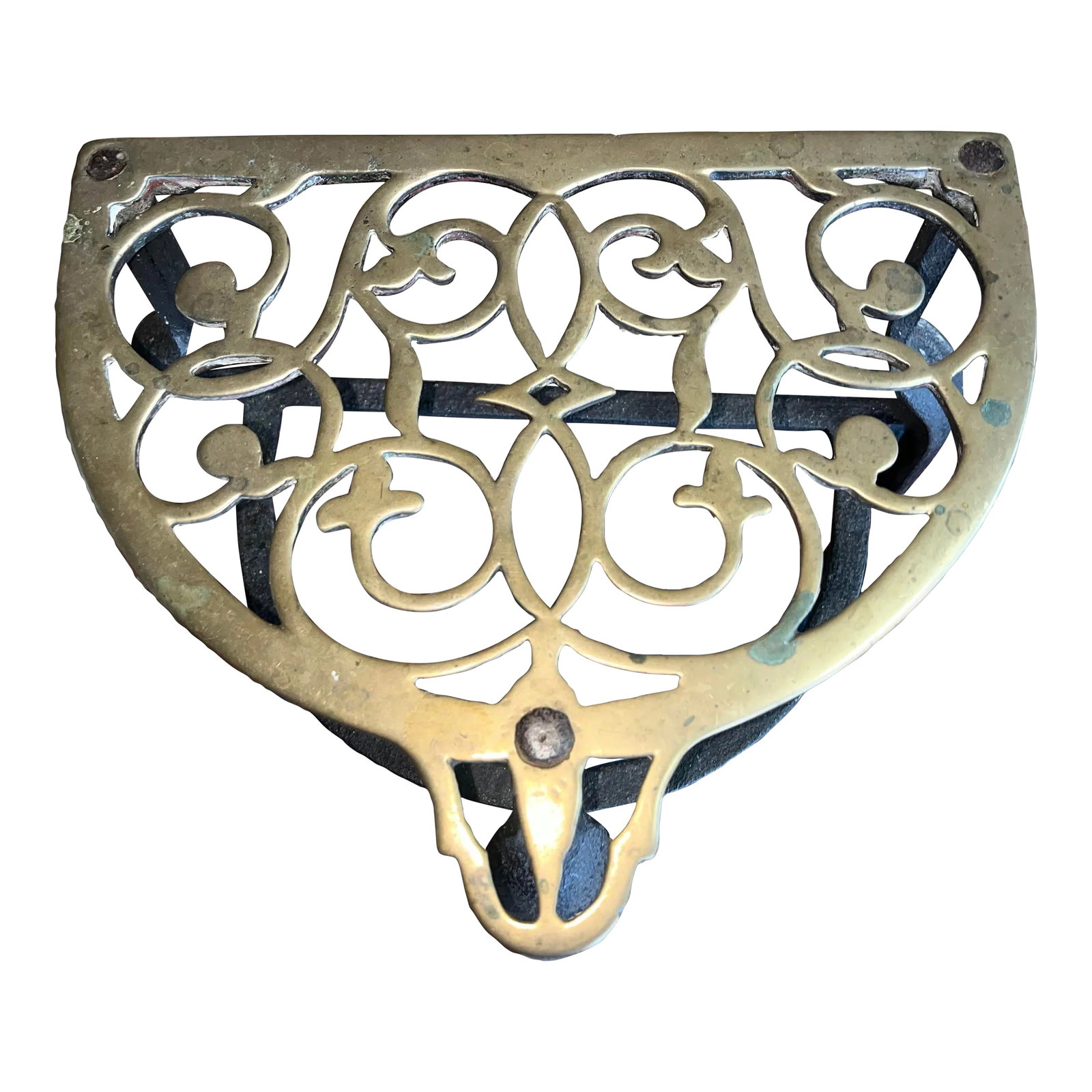 Early 20th Century Brass & Iron Trivet Footman Stand: A beautifully aged antique English brass & iron footman. The brass top is ornately designed to add a sophisticated beauty and style to your fireplace or any room of your home. Condition: Alterations: