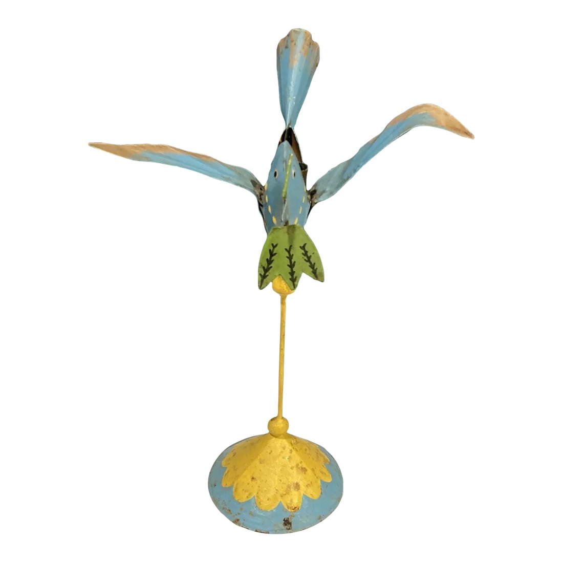 Mid 20th Century Rustic Tin Hand Painted Bird Decor: This vintage hand-painted metal bird candle holder is a delightful folk art accent full of character and color. The whimsical blue bird stands on a painted yellow base, carrying a leaf in its beak and
