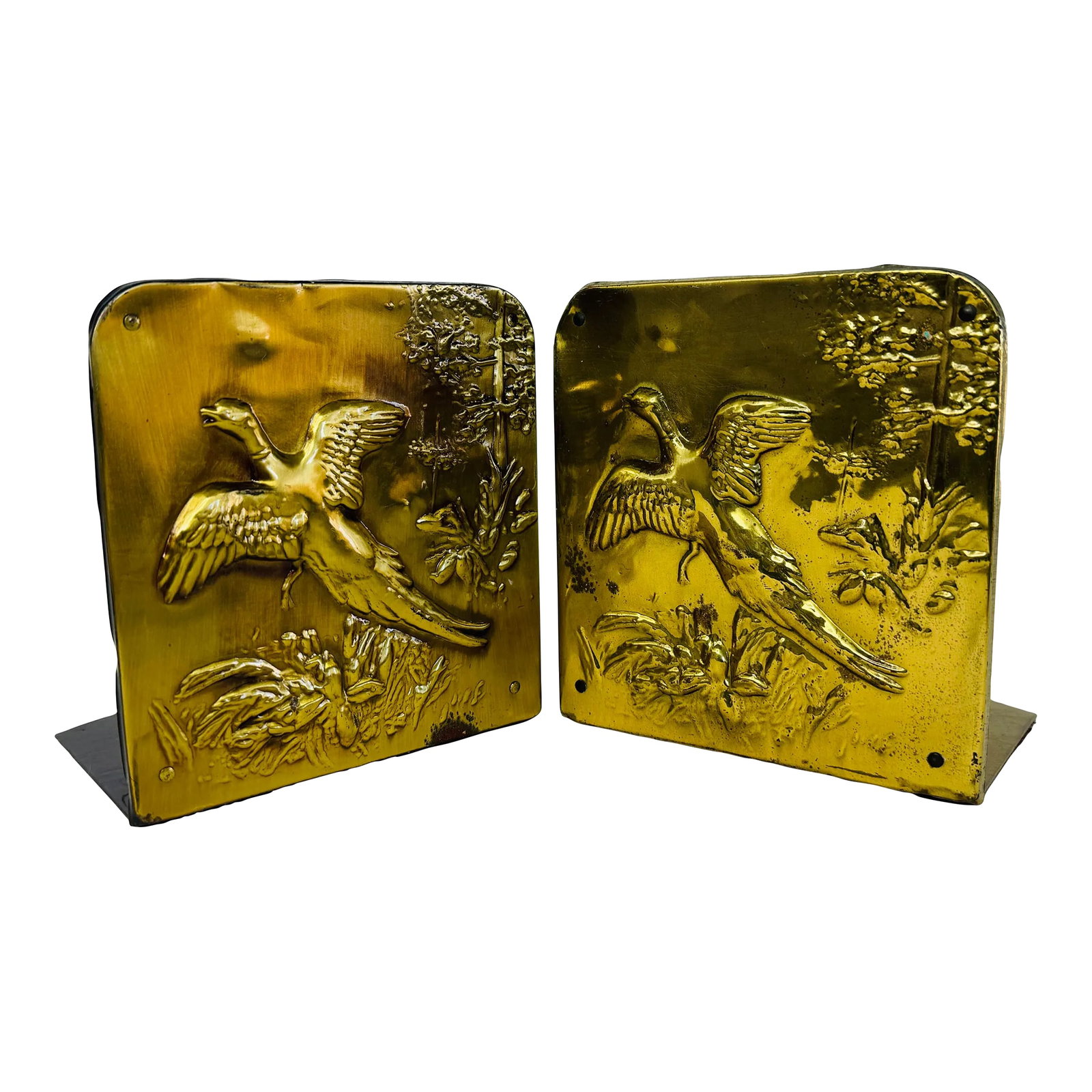 Vintage 1950s Brass Duck Bookends, a Pair: Vintage 1950s pair of brass bookends with a flying duck scene on each bookend. No marks. Condition: Alterations: Original Condition Unaltered Imperfections: Some Imperfections Condition Notes: