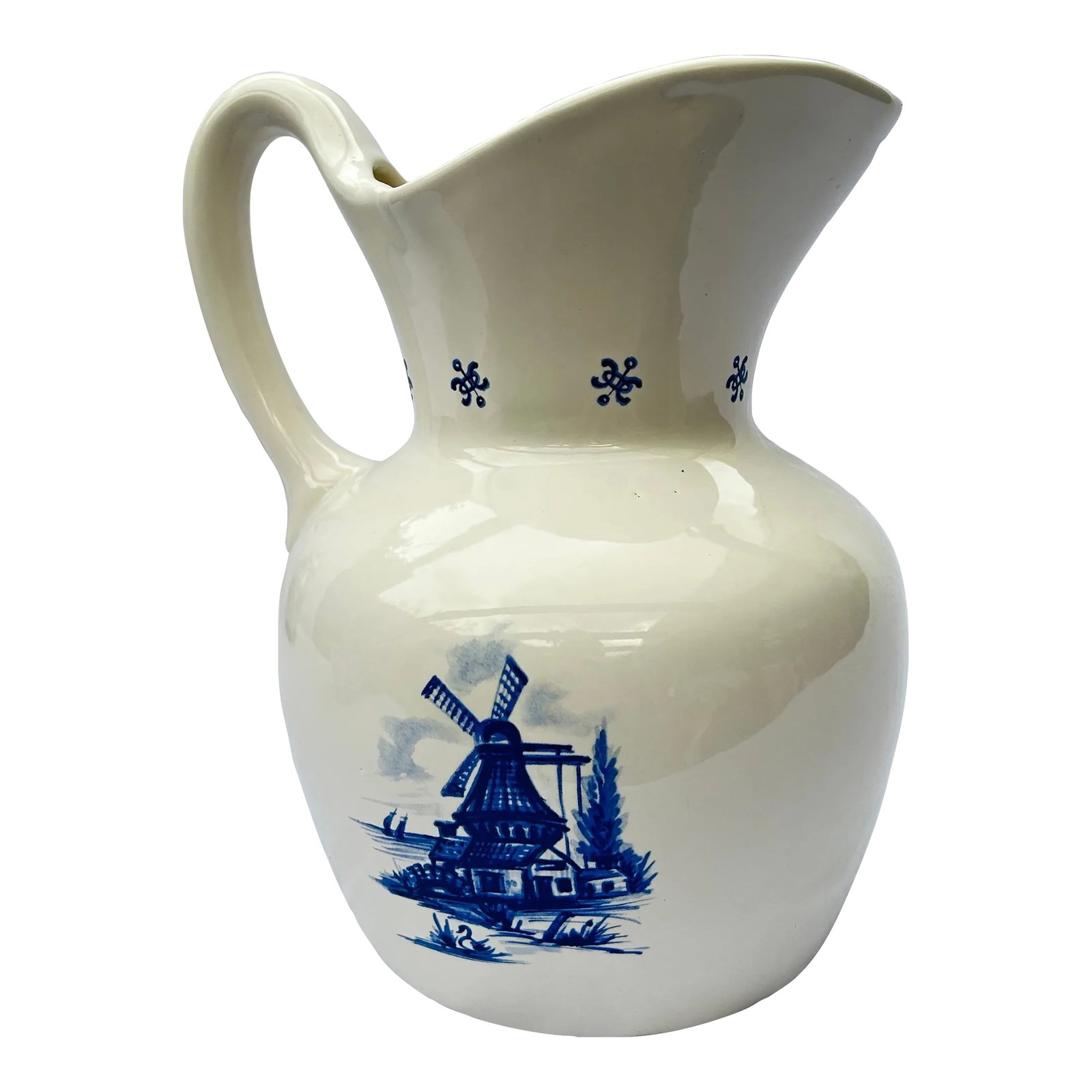Vintage Delft Blue Style Ceramic Water Pitcher: This vintage blue and white ceramic water pitcher features Delft style artwork on a creamy white base. A windmill on one side and a cottage on the other makes it the perfect addition to your decor