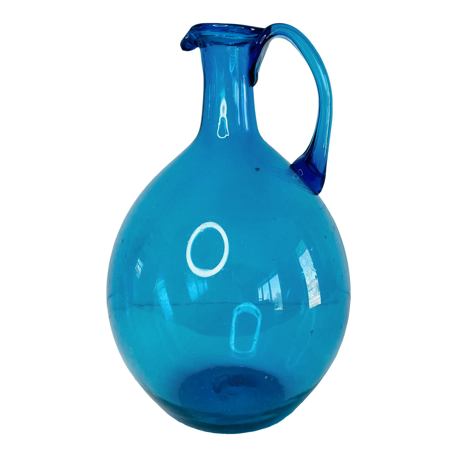 Vintage 1960s Blue Glass Jug: Vintage 1960s Blenko Style Blue Glass Jug with an applied handle and a rolled lip. Beautiful classic blue color, this jug is hand blown and hand made. Condition: Alterations: Original Condition Unalte