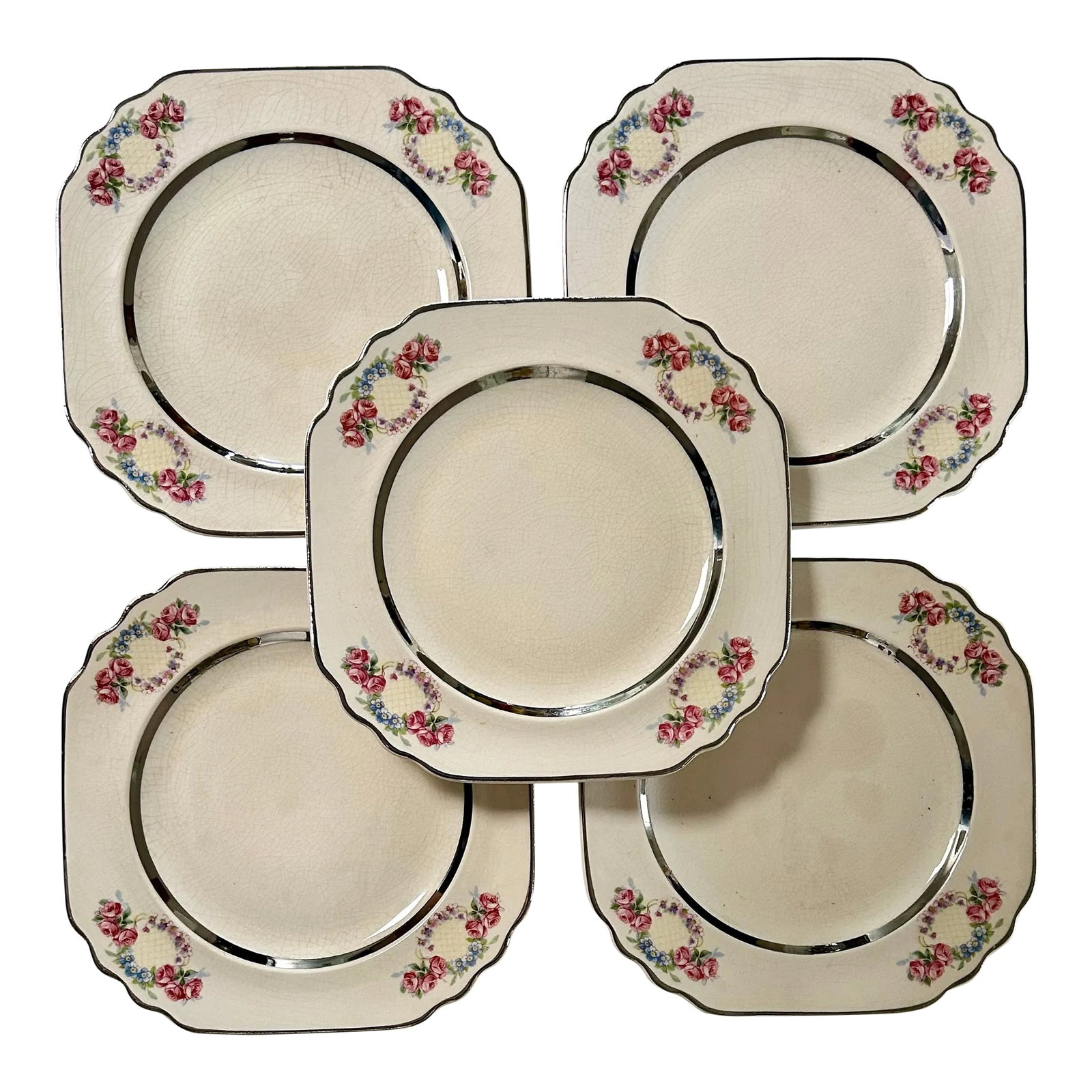 Limoges Art Deco Pink Floral and Silver Trim Dessert Plates - Set of 5: Art Deco Design.: Square with Scalloped Edges Trimmed in Silver This set of 5 pretty porcelain dessert plates feature artwork of stylized floral wreaths in soft pink and blue in each of the four corne