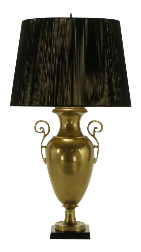 Circa 1972 Chapman Brass Urn Form Table Lamp.: Vintage Chapman Lighting urn form table lamp. Solid brass with open fretwork brass handles, and black marble base. Sold sans shade. Condition: Alterations: Original Condition Unaltered Imperfections: 