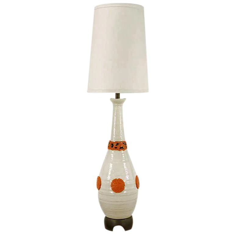 56" Nardini Studio White & Red Reticulated Pottery Table Lamp: Monumental white ceramic vase form table lamp with crackle glaze finish and red glazed Asian style characters. Base is carved wood, stem is lacquered black with a patinated brass cup and milk glass