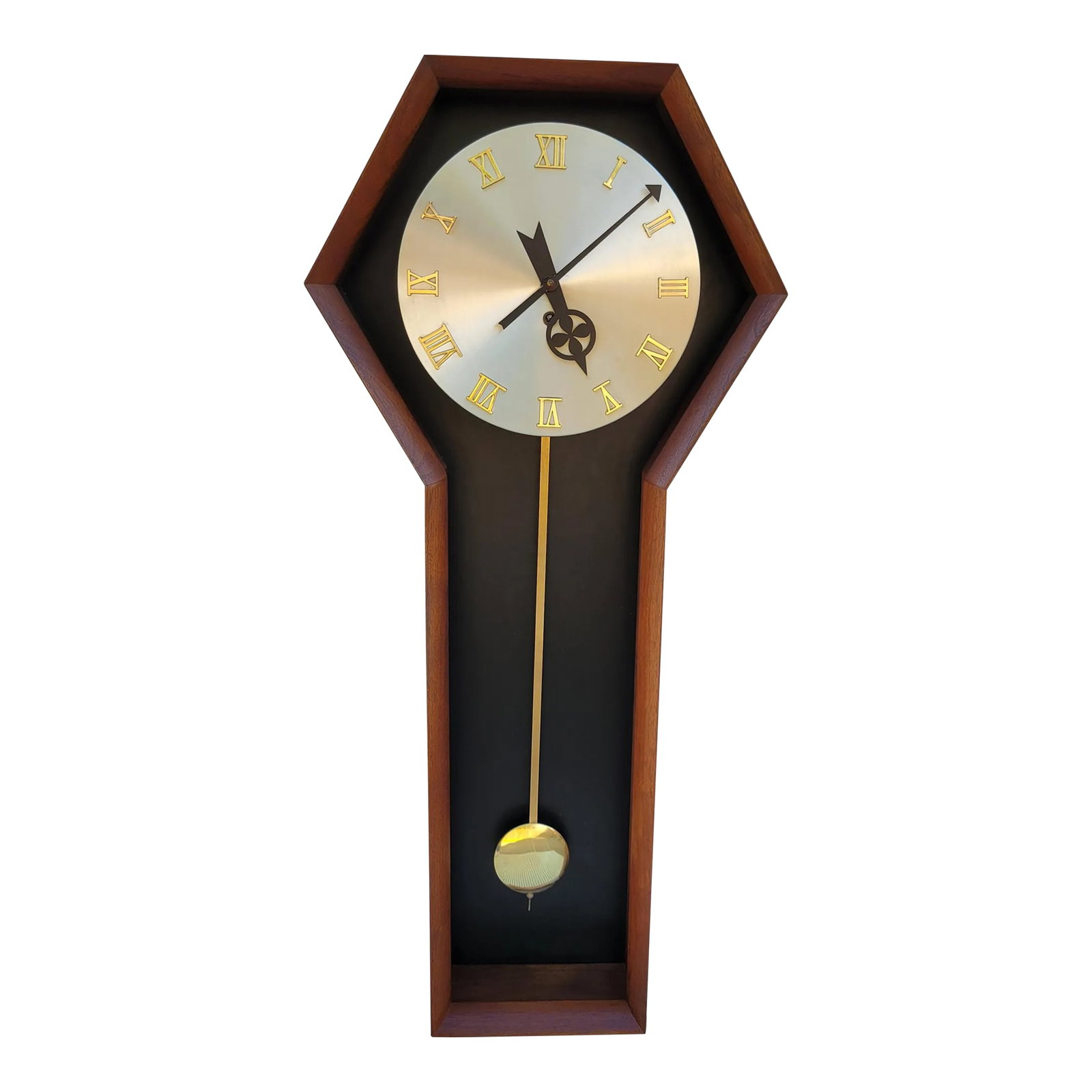 1960s Mid Century Howard Miller Arthur Umanoff Wall Clock: Stunning mid century pendulum wall clock designed by Arthur Umanoff for Howard Miller, Zeeland, Michigan. Model # 557 and part of the Meridian Line, this clock has a beautiful walnut case, brass pendu