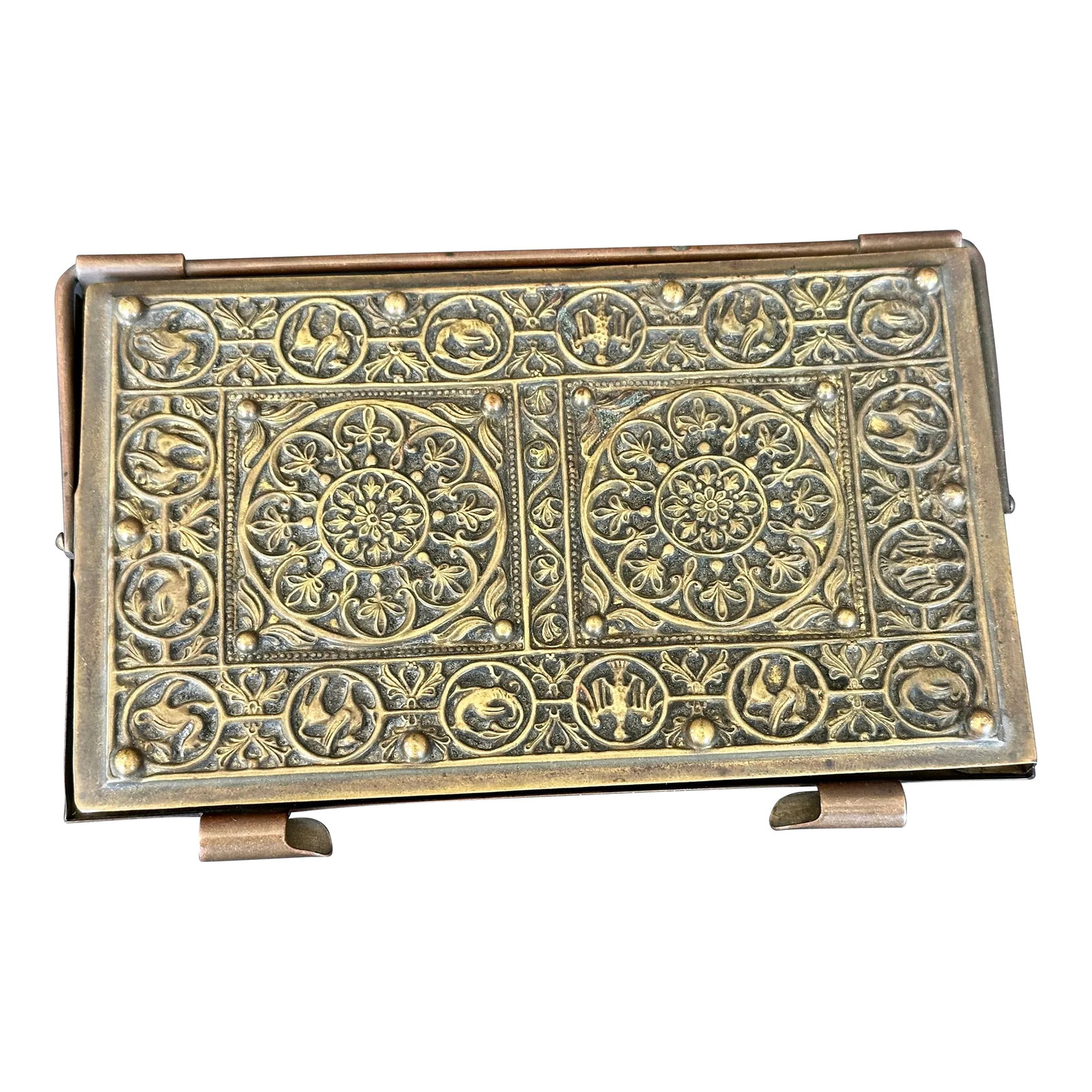 Antique Weimar Germany Bronze Box Notebook Case: Made in Weimar Era Germany, this ornate bronze metal case once held a small pocket-size note pad. The case hinges open and the top swivels. The antique bronze case has two slots along the opening