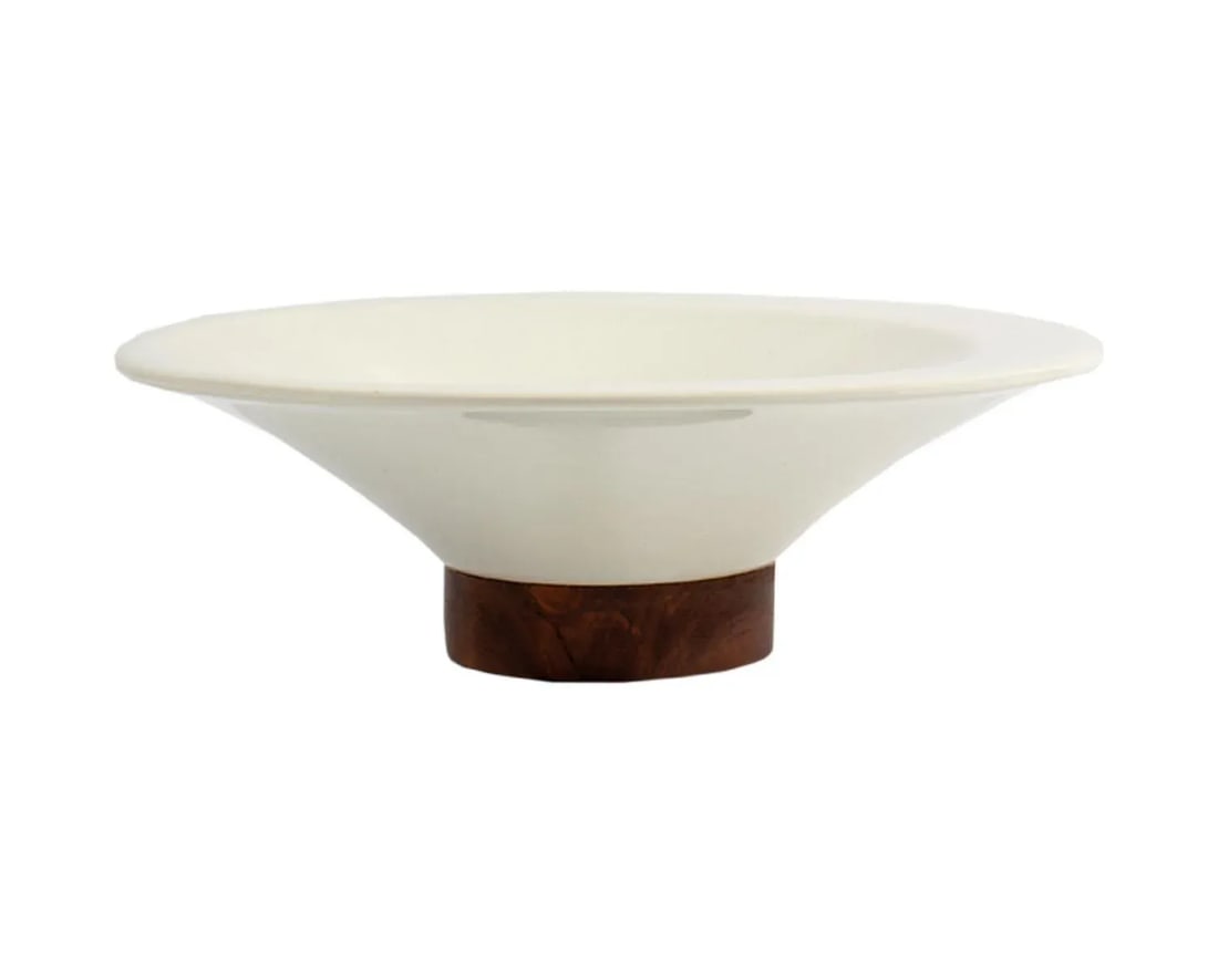 Michael Lax Hyalyn "Capri" for Raymor Small Bowl: A mid-century Capri small bowl designed by the American industrial designer Michael Lax (1929-1999) for Raymor. The round white porcelain bowl sits upon a walnut base. The Capri line was originally in
