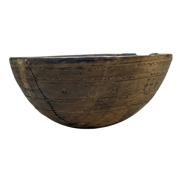 Antique African (Taureg) Wooden Bowls: This authentic vintage Tuareg wood bowl was originally used to store food and as liquid containers for soured milk and yogurt; which is a part of the Tuaregs' main diet. It is hand carved from thin