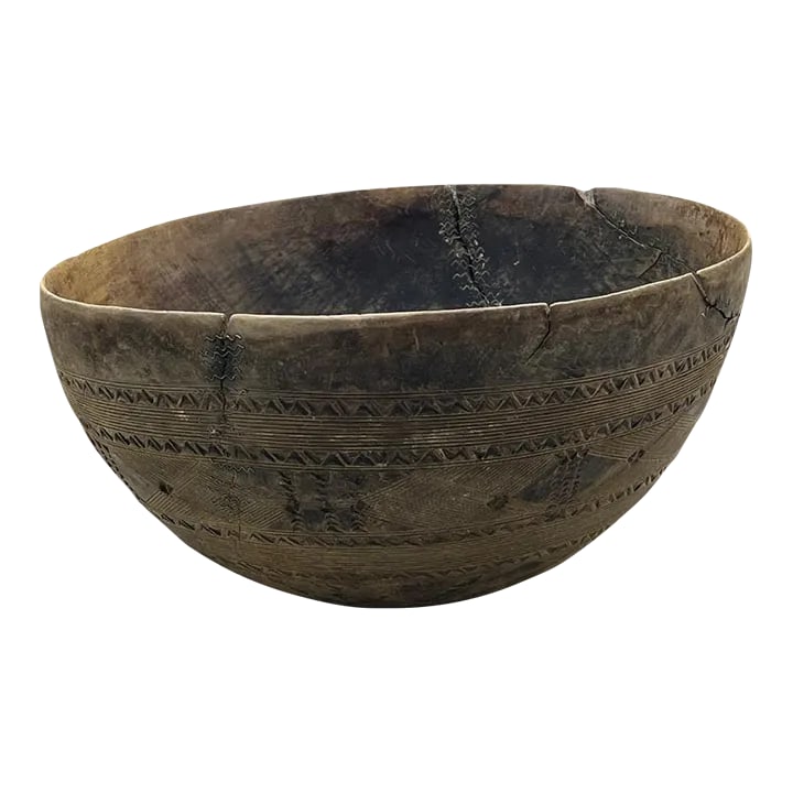 Antique African (Taureg) Wooden Bowls: This authentic vintage Tuareg wood bowl was originally used to store food and as liquid containers for soured milk and yogurt; which is a part of the Tuaregs' main diet. It is hand carved from thin