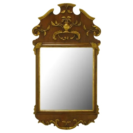 58" Carved Walnut Parcel Gilt Italianate Mirror.: Walnut wood with carved and gilt Italianate detail style mirror. Top detailing features a floral accented urn and rococo style filigree. Carved and gilt bracketed corners and bottom filigree.
