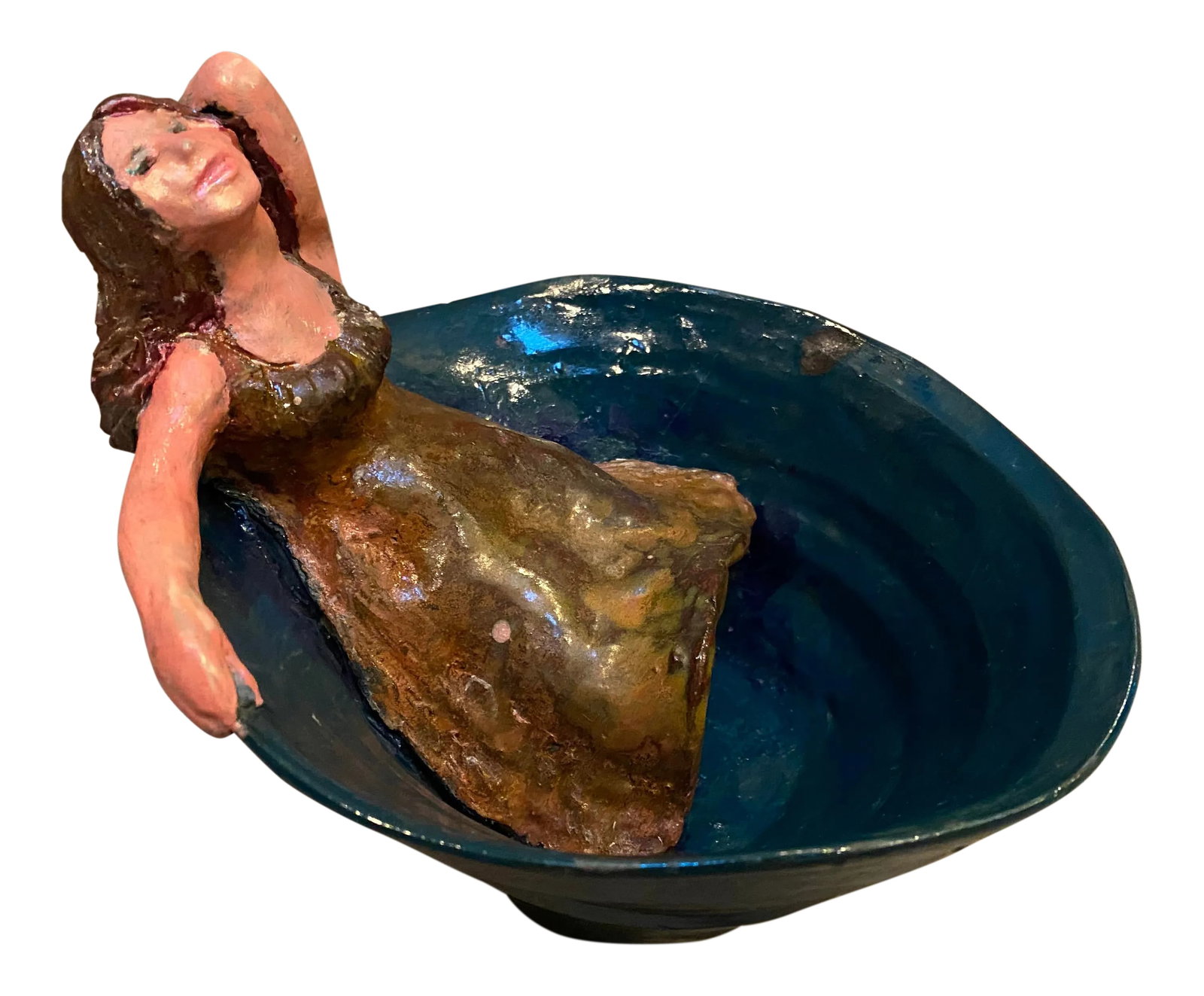 Blue Pottery Bowl With Reclining Girl in a Dress: Whimsical pottery bowl with a reclining girl inside a blue bowl. Color is a deep aqua green blue. She is quite pink skinned and dress and hair are brown. Fun piece! Condition: Imperfections: No Imperf