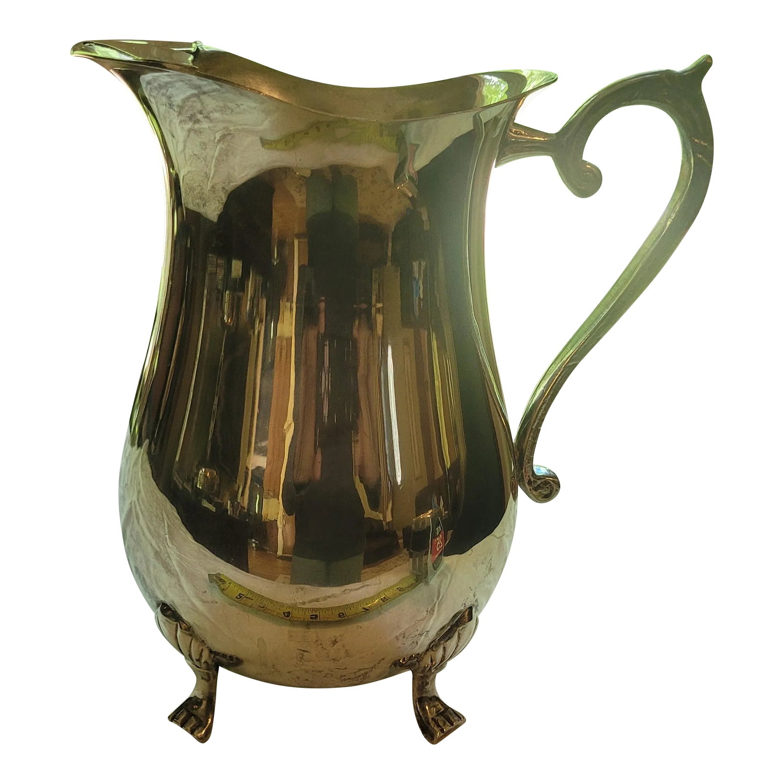 Vintage Silverplate Pitcher With Ornate Feet: Charming & Elegant: This vintage silverplate pitcher is a beautiful addition to any table setting or home decor. Its classic design features ornate feet and a graceful handle. Versatile: Perfect for s