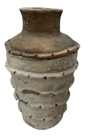 Gafsa Clay Vessel: This Gafsa clay vessel hails from Tunisia, specifically the town of Gafsa known for its pottery craftsmanship. This traditional vessel is crafted from locally sourced clay, showcasing the region's