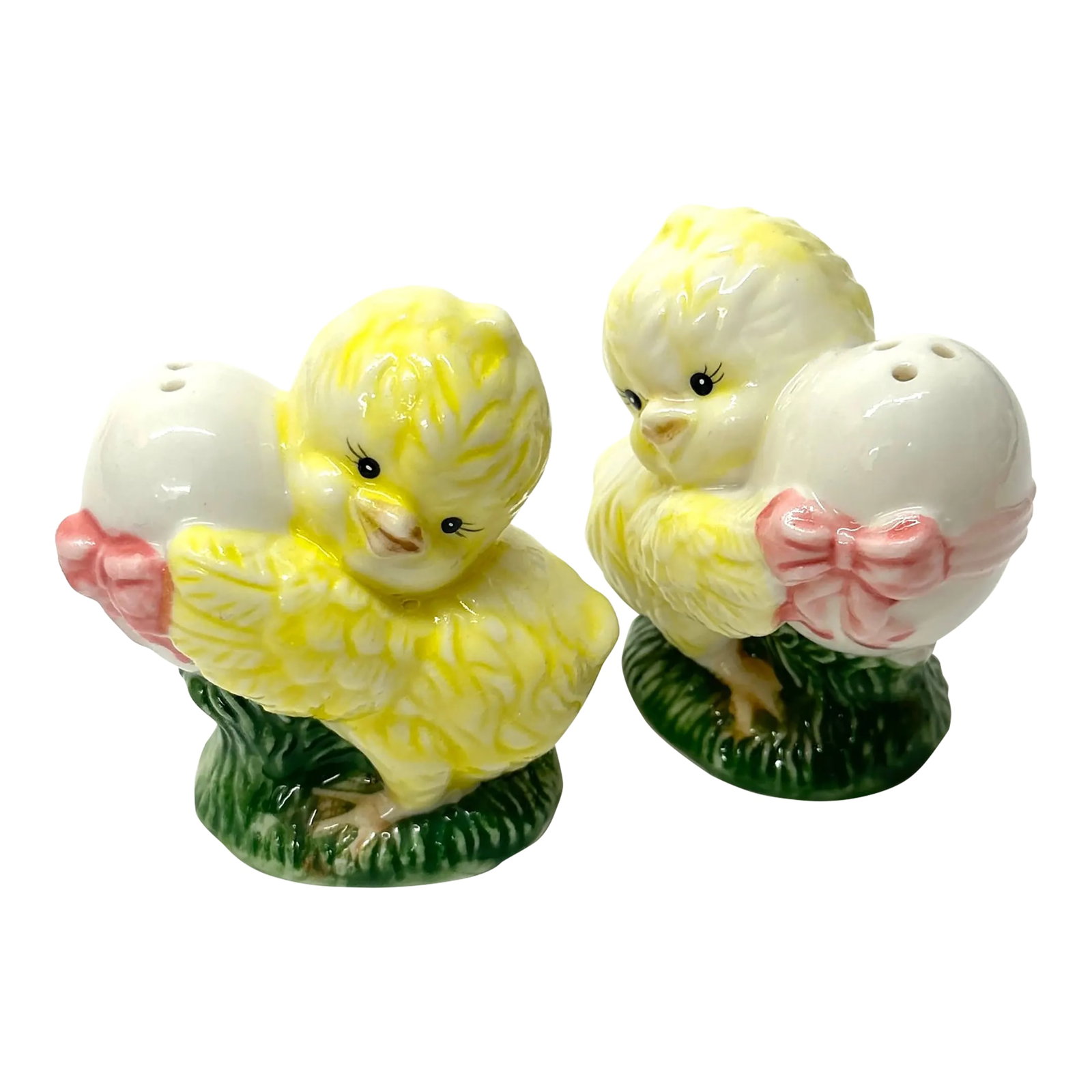 Spring Chickens Ceramic Salt & Pepper Shakers: Chicks with eggs salt & pepper shakers, group of 2. A precious little easter set of mid-century ceramic shakers, featuring chicks holding ribbon-wrapped eggs. Height: 2.75" Width: 2.75" Condition: