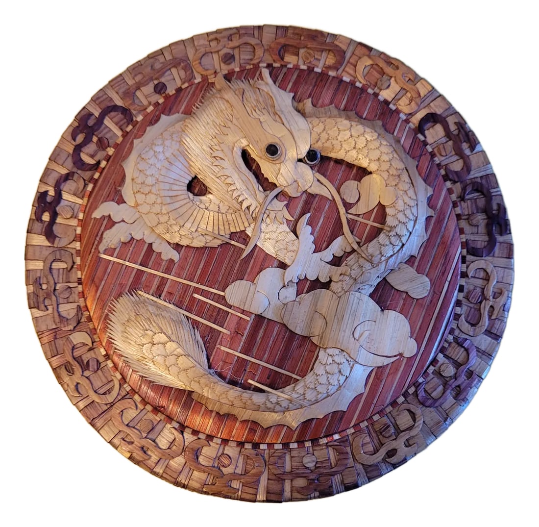 Late 20th Century Bamboo Dragon Trinket Box: This intricate bamboo box features a striking dragon design on the lid and a vibrant red satin interior. Measuring 4.75" in diameter and 1.875" tall, it's perfect for storing jewelry, keepsakes, or