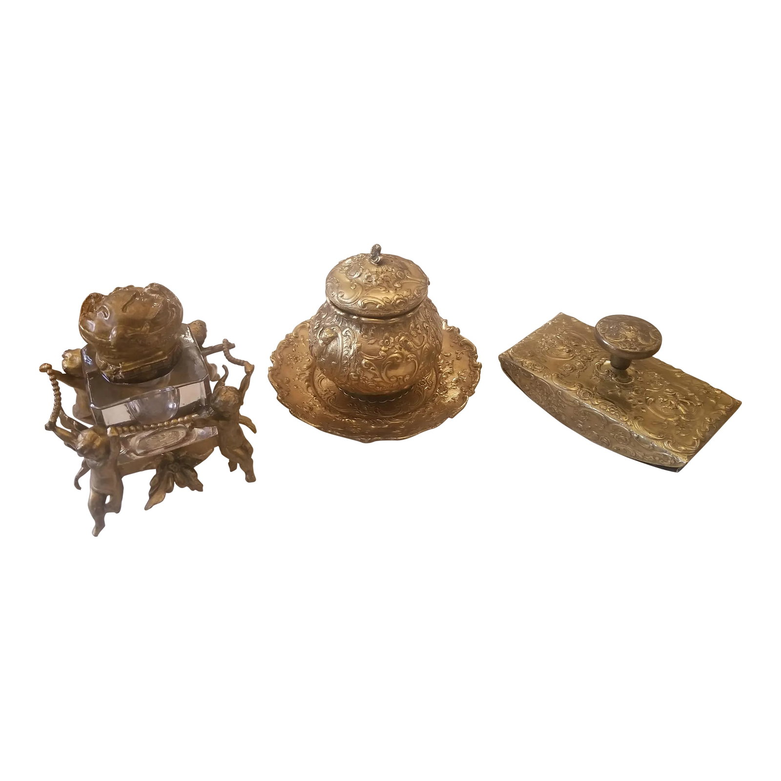 Antique Victorian Brass Inkwell Set of 3 Pieces: Beautiful Antique Brass Desk Set. Sold as set Of 3 Cherub glass inkwell, large brass Inkwell and brass roller Condition: Alterations: Original Condition Unaltered Imperfections: Some Imperfections