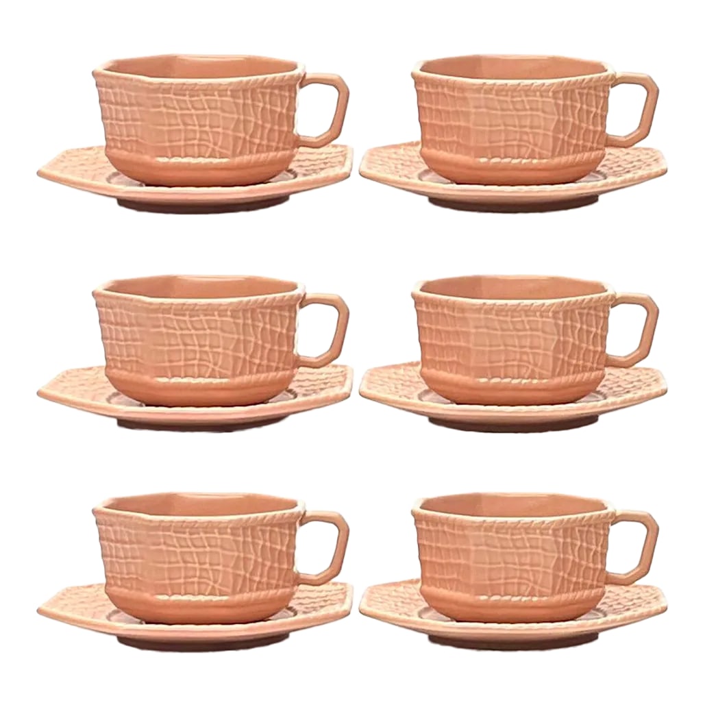 Immaculate Blush Colored Tea Cups & Saucers by Bordallo Pinheiro Portugal - Set of 6: Blush cups and saucers, group of 6. This group of blush-pink ceramic cups and saucers are octagonal with a soft-matte net texture by Bordallo Pinheiro, made in Portugal. Height: 2.5" Width: 4"