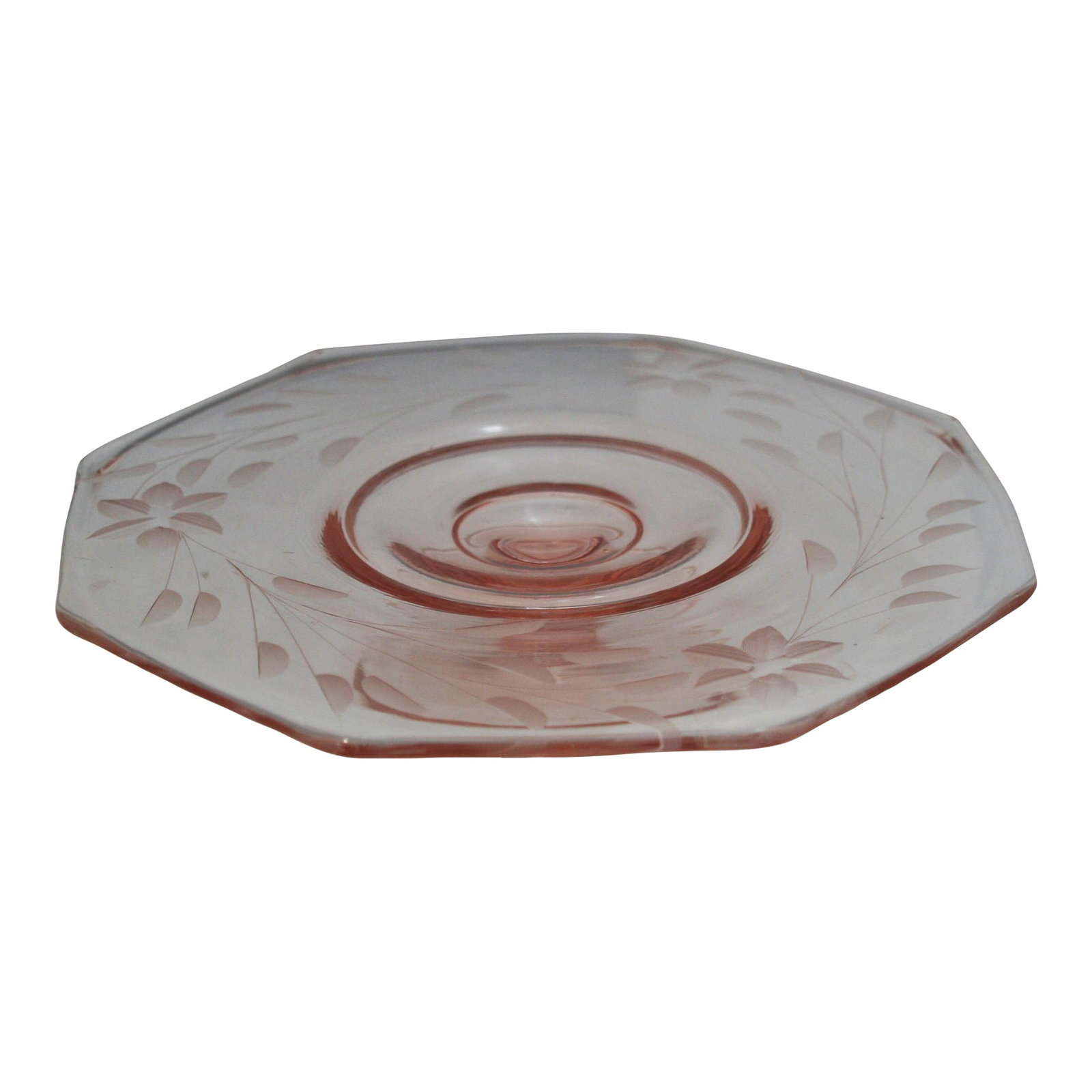 Vintage Pink Depression Glass Octagonal Floral Etched Cake Stand: Vintage Pink Depression Glass Octagon Shaped Footed Cake Plate This vintage cake stand was produced during the 1930s. The glass is a translucent pink color and is decorated in an etched floral motif.