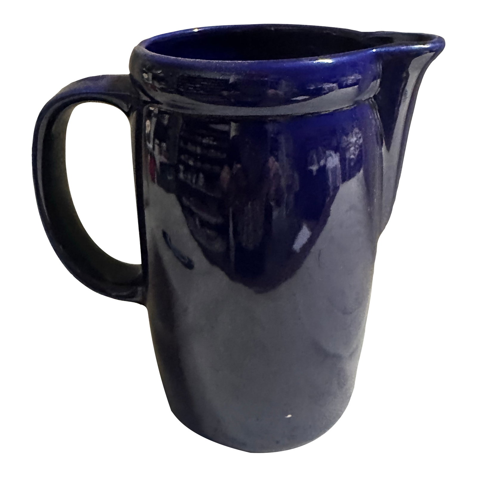 Vintage McCoy Number 1429 Made in the Usa Cobalt Blue Water/Milk Pitcher: This is a must for a collectors inventory. It has a beautiful cobalt blue glossy finish to it. It has a curved design with a handle. it has no chips, no cracks. Condition: Alterations: Original