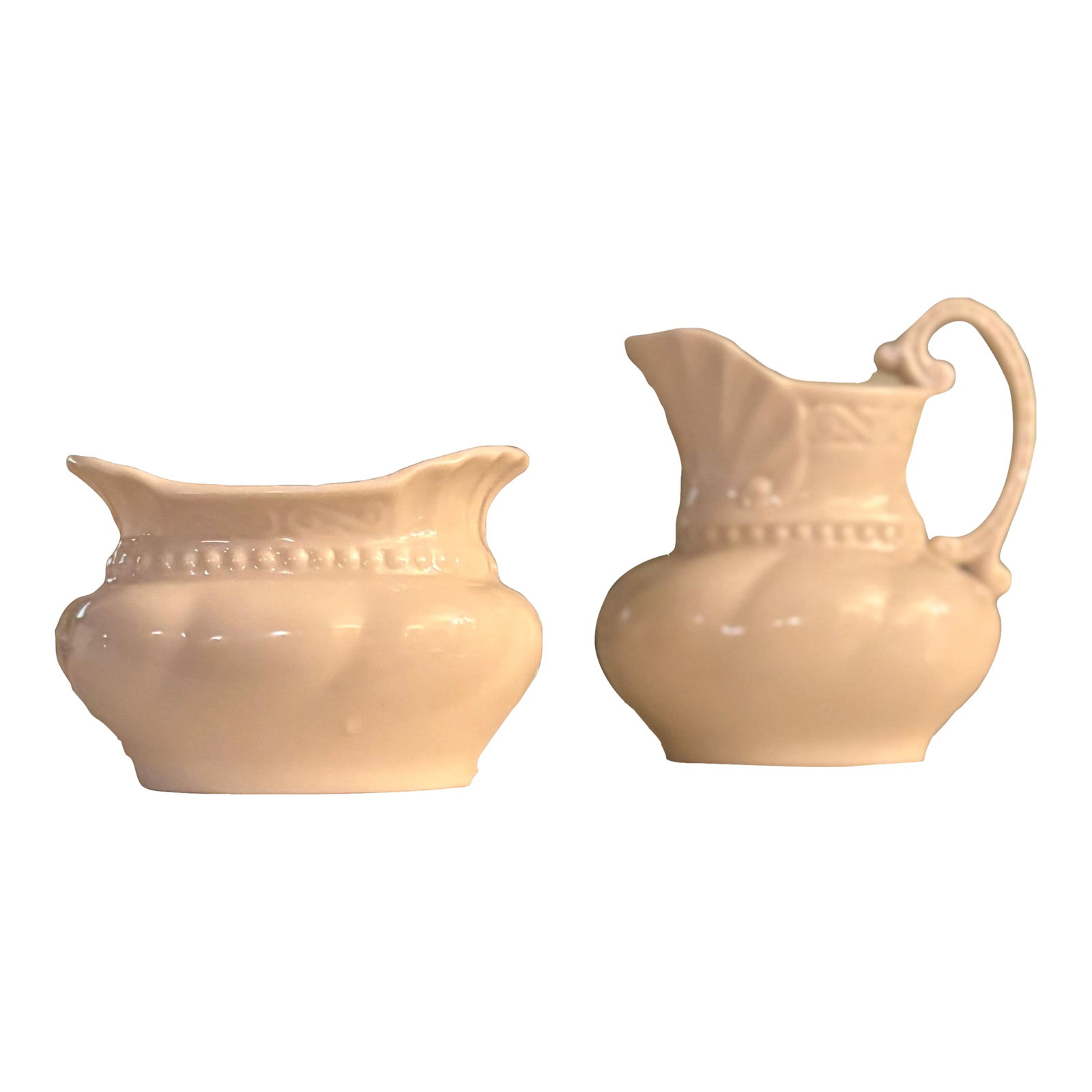 Mid 20th Century Lenox Colonial Collection Porcelain Creamer and Sugar Bowl Set: This elegant creamer and sugar bowl set is delicately rendered in ivory porcelain by Lenox as part of their Colonial Collection. Produced in the United States from 1953-1988 Maker's Mark stamped in