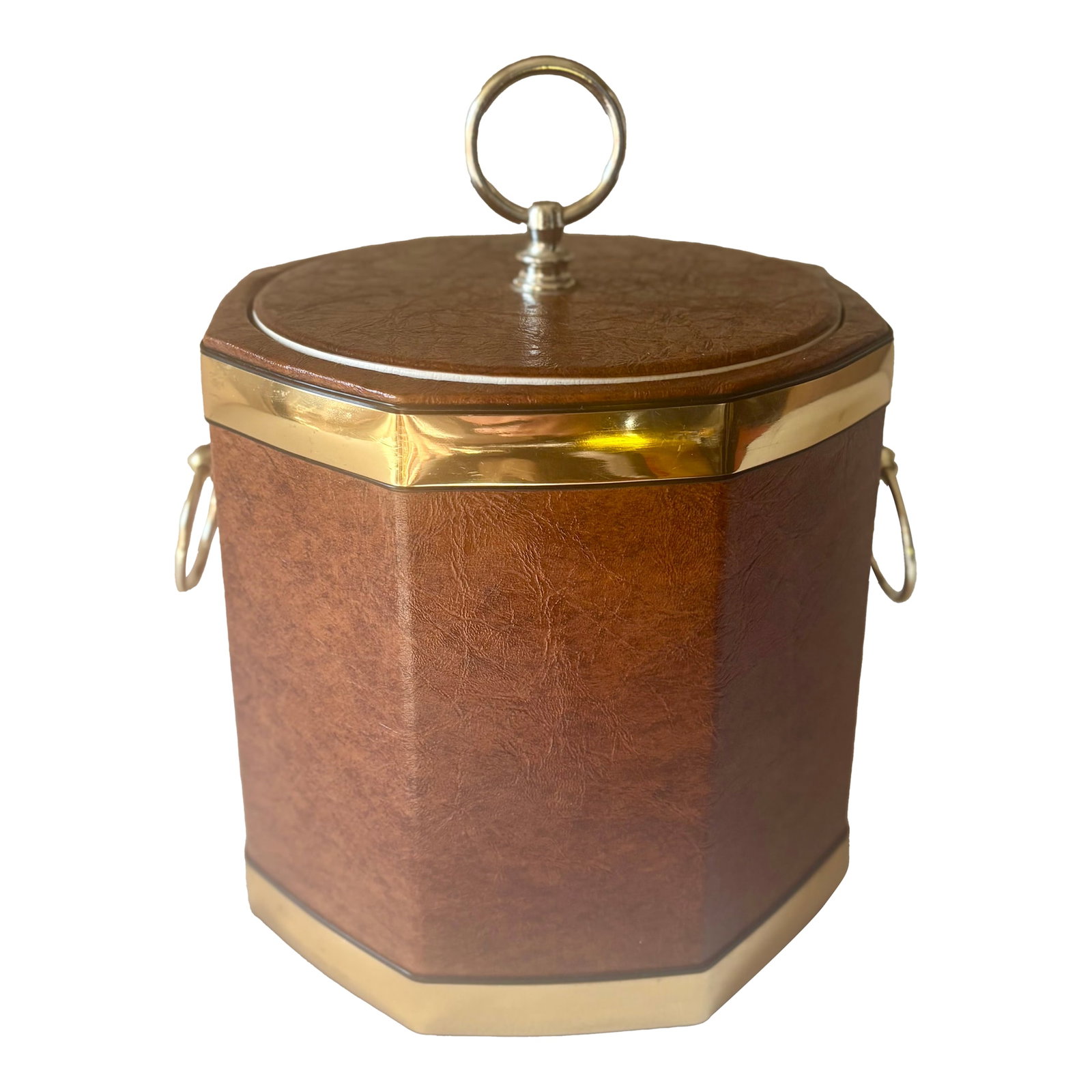 1970's Georges Briard Style Hollywood Regency Faux Burlwood Leatherette Ice Bucket With Gold Fitting: Add a touch of Hollywood Regency glamour to your bar of cocktail cart with this brown faux burlwood leatherette ice bucket with gold colored metal fittings and trim. The striking octogonal shape of th