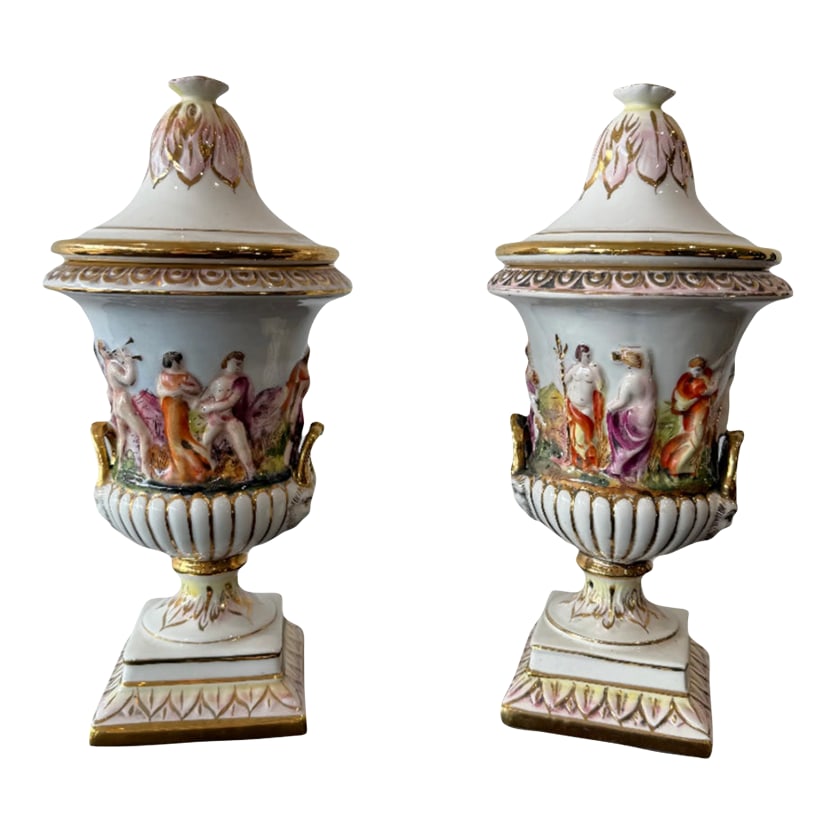 Vintage Italian Decorative Urns- Set of 2: This is a pair of decorative porcelain urns/vases by Kerimos R. Capodimonte. Italian made. These will be wonderful gracing a mantle, in an foyer or elegant table display. There are a few blemishes as