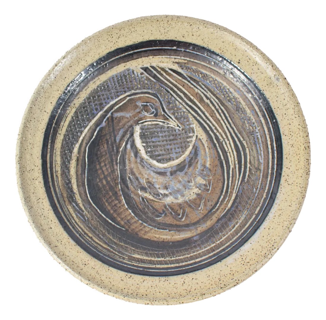 Beaver Ridge Studio Pottery Plate With Bird by Charles Counts: A decorative plate by American artist Charles Counts (1934-2000) for Beaver Ridge Studio Pottery. The rounded plate features an incised design of a bird. Signed "Beaver Ridge" to the underside.